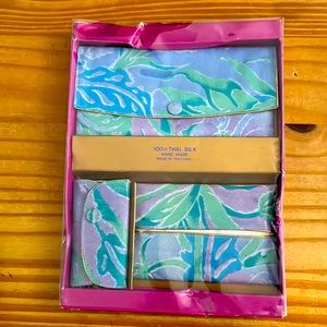 Trio of silk bags including cosmetic bag, tissue holder and key holder